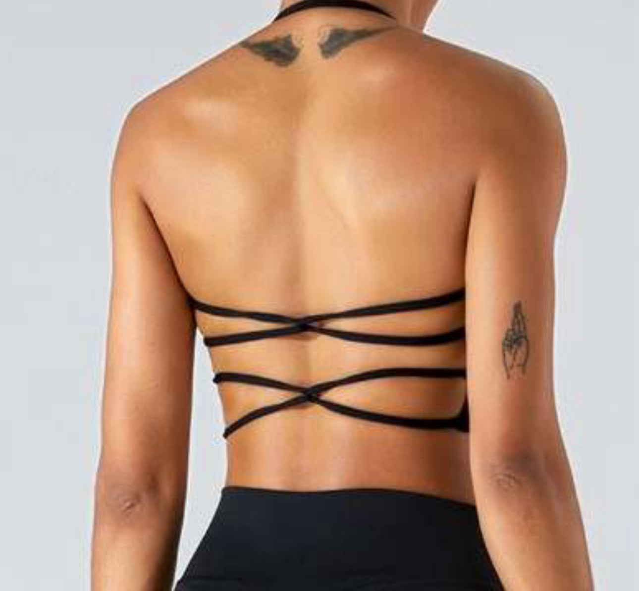 Twisted backless halter sports bra